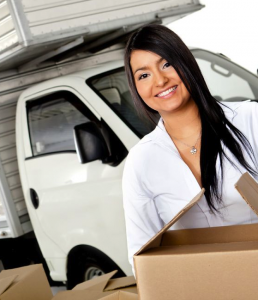 Lady carrying a moving box