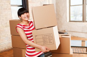 Young girl moving in apartment