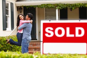 couple celebrating buying a house