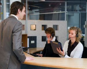 receptionist helping customer